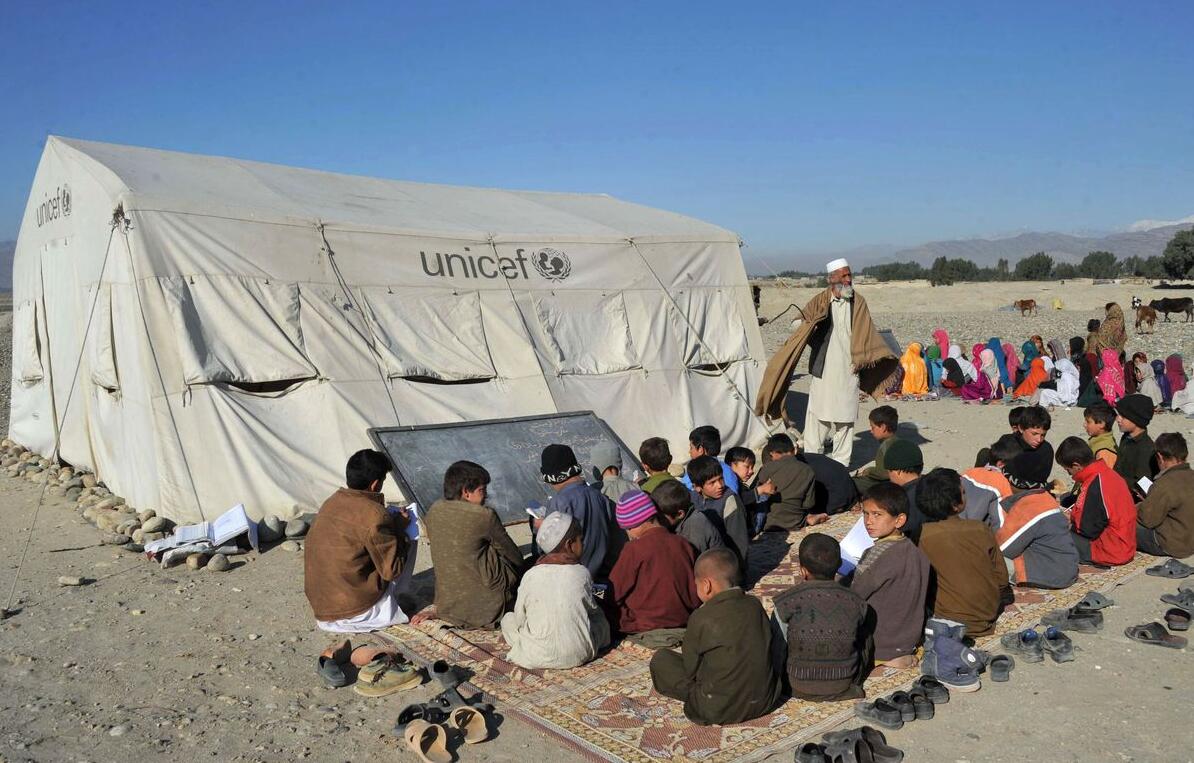 Afghan schoolchildren in an outdoor classroom on the outskirts of Jalalabad, in Nangarhar Province, February 16, 2014.